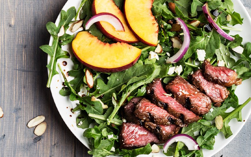 Grilled Grass-Fed Strip Steak Salad with Peaches