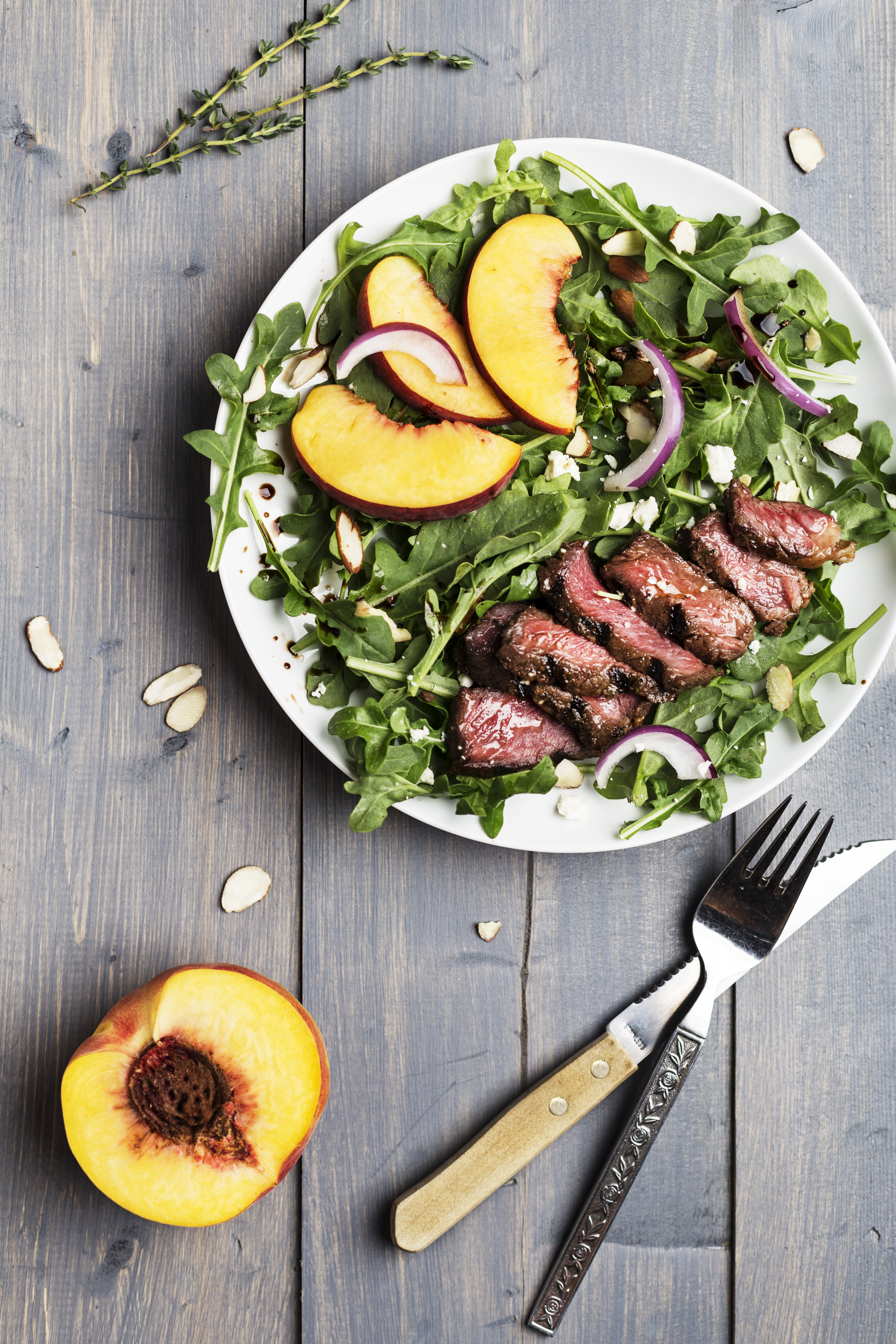 Grilled Grass-Fed Strip Steak Salad with Peaches